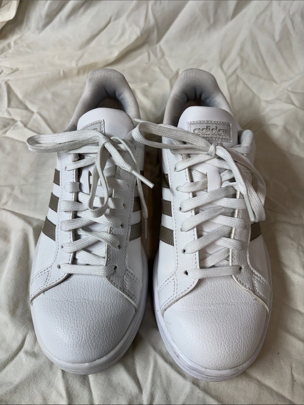 Adidas White Sneakers with gray/silver Stripes.